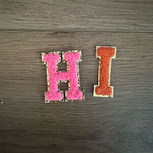 Gold and Pink 'HI' iron on patch